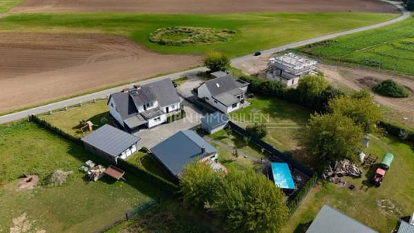 Immobilie in Dummerstorf - Landglück bei Rostock: Familienhaus mit Einliegerwohnung, Pool und Partyraum - Bild 1