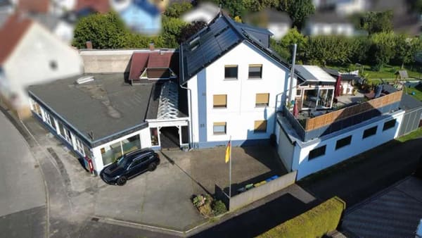 Immobilie in Biebertal - Großzügiges Mehrfamilienhaus mit außergewöhnlichem Flächenangebot und vielseitigem Potenzial - Bild 1