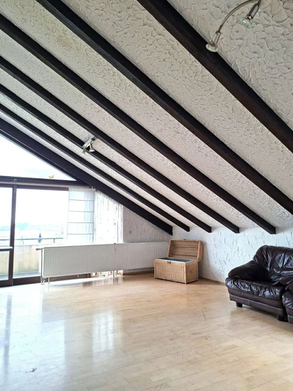 Immobilie in Rainau - Charmante 4-Zimmer-Dachgeschosswohnung mit 2 Balkonen, Gartenanteil und traumhafter Aussicht - Bild 0