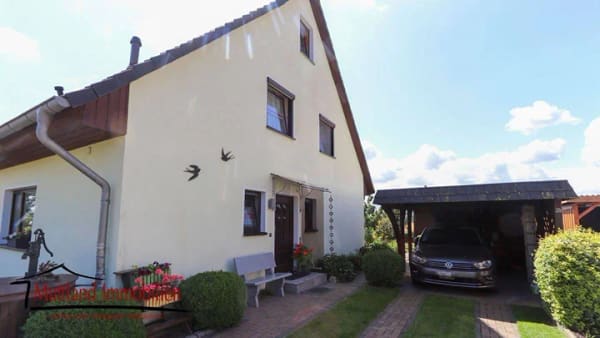 Immobilie in Niepars - Charmante Doppelhaushälfte mit Sommergarten, Photovoltaikanlage und gepflegtem Grundstück - Bild 1
