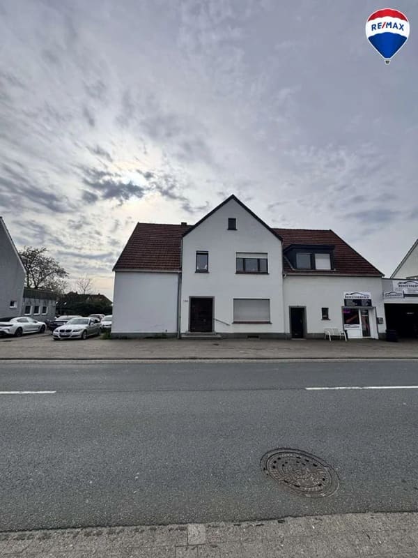 Immobilie in Spenge - Zweifamilienhaus + KFZ-Werkstatt auf großem Grundstück in Spenge zu verkaufen! 6% Rendite! - Bild 0