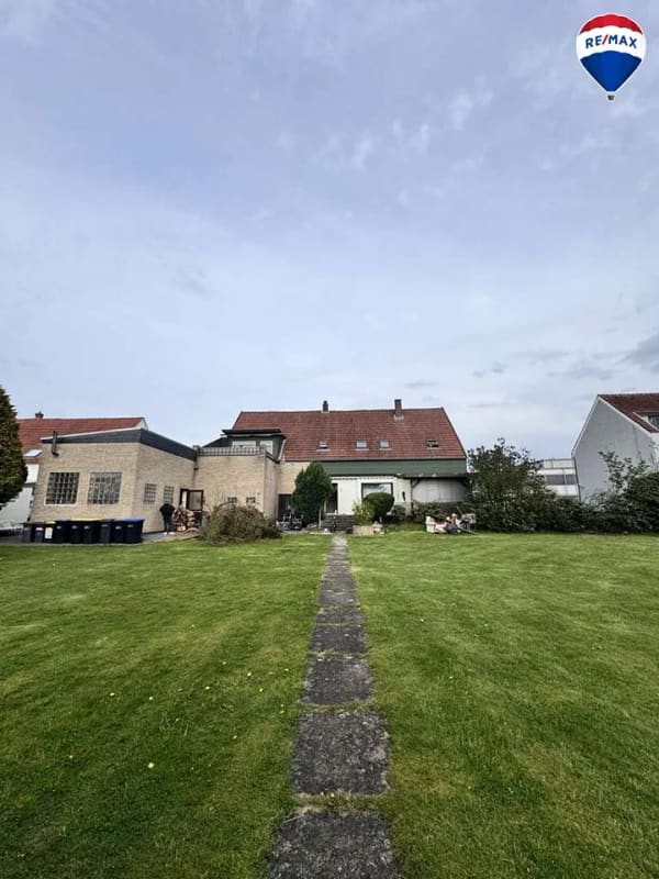 Immobilie in Spenge - Zweifamilienhaus + KFZ-Werkstatt auf großem Grundstück in Spenge zu verkaufen! 6% Rendite! - Bild 1