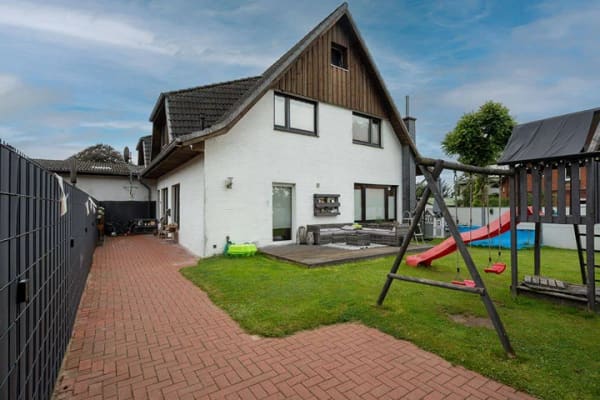 Immobilie in Süderheistedt - Großzügige Doppelhaushälfte mit vielseitigem Raumangebot und schönem Garten - Bild 1