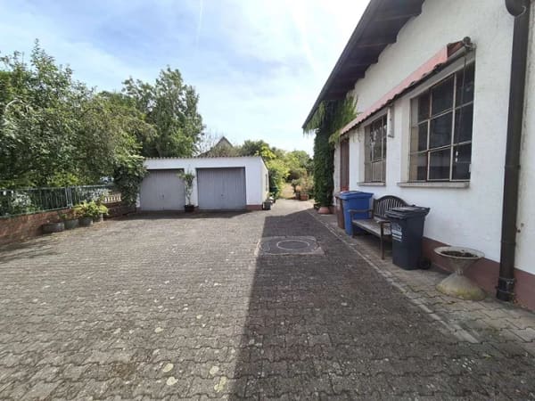 Immobilie in Ramstein-Miesenbach - Vielseitiges Wohn- und Geschäftshaus mit großzügigem Grundstück im Ortszentrum - Bild 2