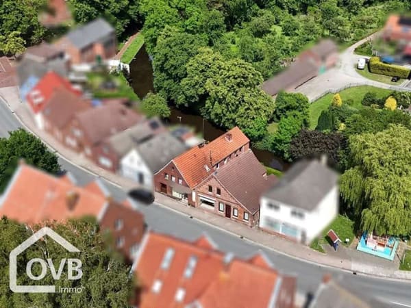 Immobilie in Moormerland - Zwei Häuser mit Bootsanleger zu einem Preis! Direkt am Wasser! - Bild 1